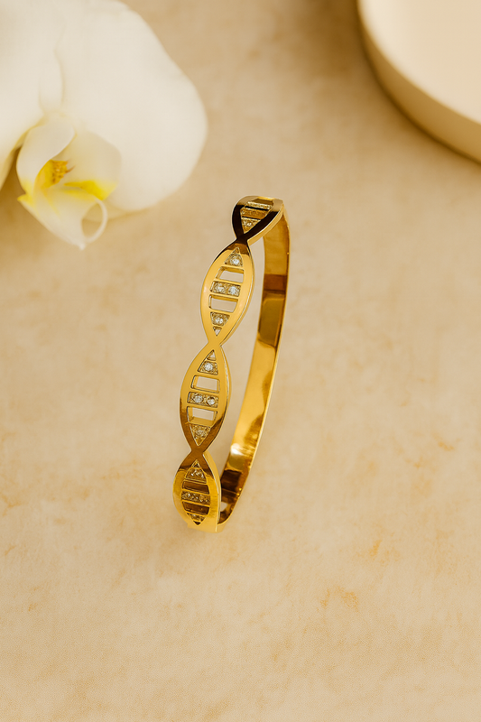 Golden cuff bracelet with geometric, DNA-inspired design